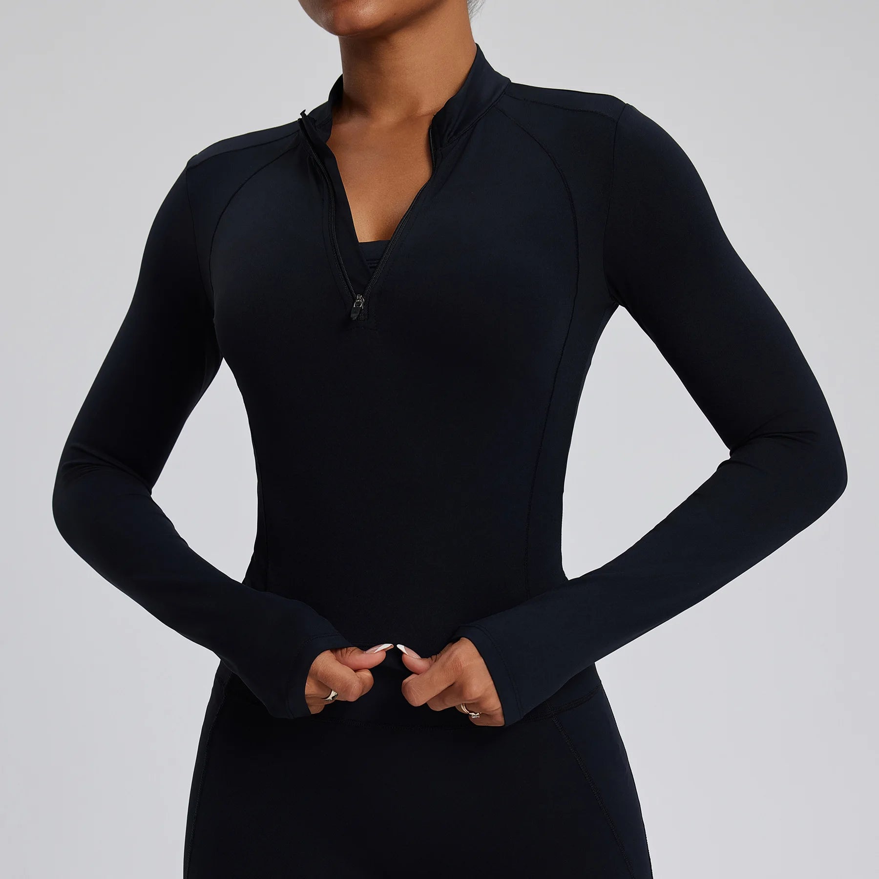 Black Quarter Zip for yoga, pilates, running, or any kind of active lifestyle, offering breathable and stylish activewear.